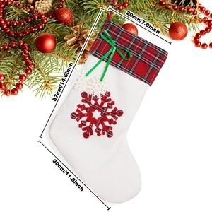 Christmas dog paw stocking in red and green plaid pattern with dimensions 37cm x 30cm