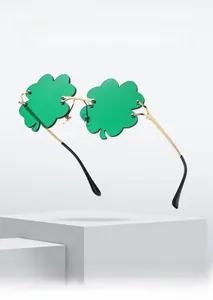 Close-up of green shamrock-shaped lenses with elegant gold metal frames for parties