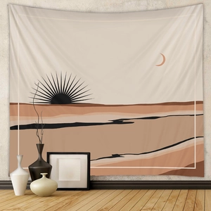 Detail of bohemian tapestry with sun and desert landscape in a modern interior setting