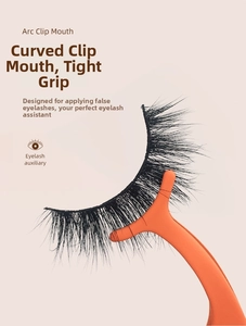 Detail of orange eyelash applicator with ergonomic curved tip for precision makeup
