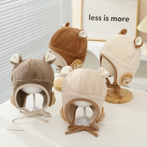 Plush lion-themed earflap hats for kids in brown beige grey and cream colors