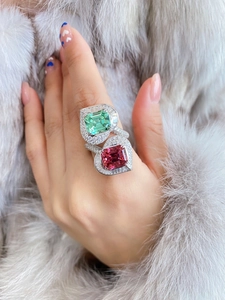 Macro shot of silver ring with luxury square cut green and pink tourmaline stones