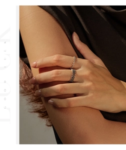 Close-up of S925 sterling silver beaded rings with retro textured finish on hand