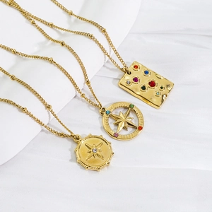 Polished 14K gold-plated stainless steel necklaces with colorful crystals and star motifs