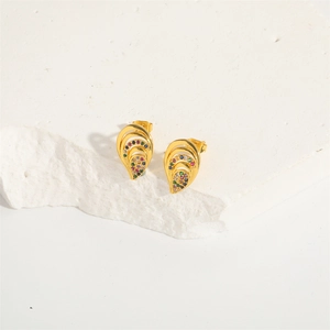 Elegant gold teardrop earrings with colorful gemstones on a white stone background
