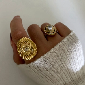 Gold stainless steel rings with spiral texture and teardrop diamond for women