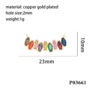 Macro detail of 18K gold plated heart zirconia charm with 23mm by 10mm size dimensions
