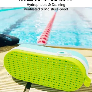 Silicone swimming goggle pouch with drainage holes in neon green and mint blue