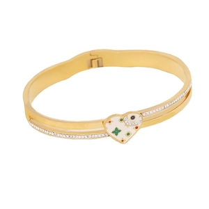 Golden stainless steel bangle featuring a heart charm with green floral and eye patterns