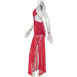 Detail of red halter dress featuring crossover waist cut-outs and side ruching detail