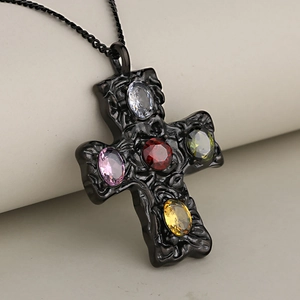 Black stainless steel cross necklace with colorful crystal zircons on a soft background