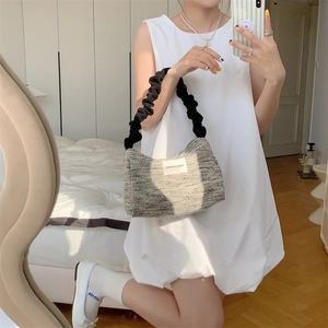 French style tweed underarm bag with black ruched cloud strap shown in mirror selfie
