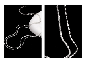 Detail of silver double-layer layered necklace with textured wave and bead chains