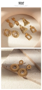 Detailed view of vintage gold hollow geometric earrings with hammered metal textures