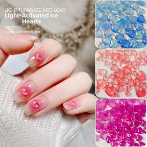 Macro detail of UV light-sensitive heart charms for nails with glossy translucent finish