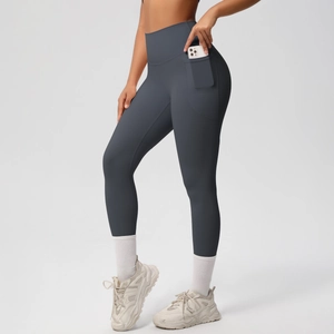Detail view of high waisted yoga leggings with a side pocket in charcoal gray matte fabric