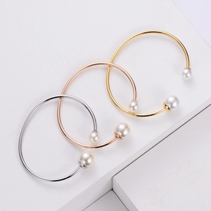 Minimalist stainless steel open bangles with pearls in gold, silver, and rose gold finishes
