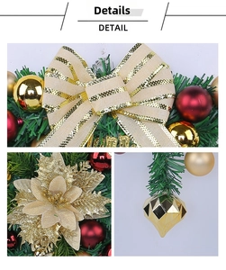 Detail of Christmas wreath with beige bow, red matte balls, and gold glitter flowers