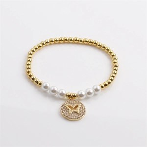 Elegant gold butterfly pendant bracelet with white pearls and beads for women