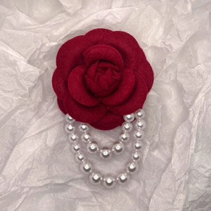 Vintage camellia pearl brooch with dark red fabric petals and white hanging chain
