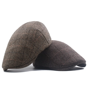 Classic grey and coffee plaid cotton newsboy caps with vintage tweed texture for winter