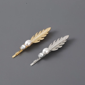 Elegant feather hair clips in gold and silver finish with pearl and rhinestone accents