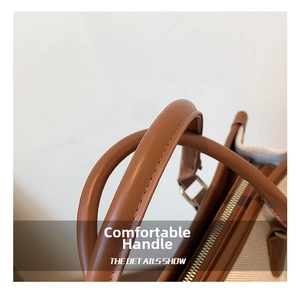 Detail der Kontrastnähte und des Canvas-Stoffs an einer braunen Bicolor-Tasche