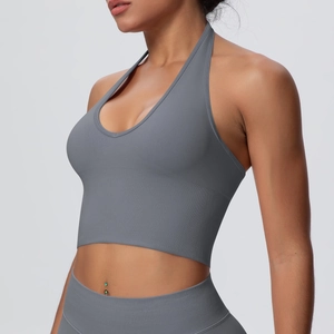 Detailed view of grey seamless ribbed halter yoga bra with deep V-neck and cropped fit