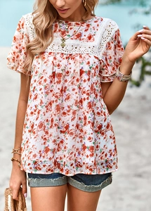 Detail of floral print top with white lace patchwork and hollow out shoulder design