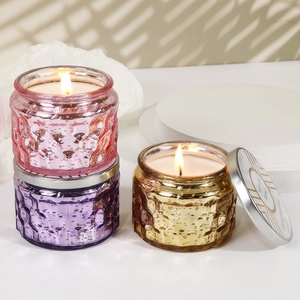 Embossed glass scented candles in pink and purple with vintage metallic lids