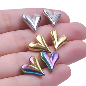 Macro shot of 304 stainless steel heart-shaped earrings in silver gold and rainbow plating