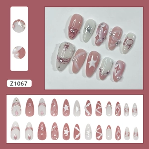 French style press-on nails with bow, pearl, and star accents in rose pink and milky white