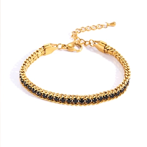 Detail of gold titanium steel tennis bracelet with black zircon stones and lobster clasp