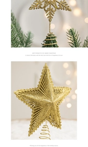 Detail of gold glitter snowflake and star tree toppers with spring base and warm lights