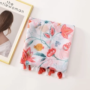 Floral print cotton scarf with orange-red blossoms and delicate fringe tassels