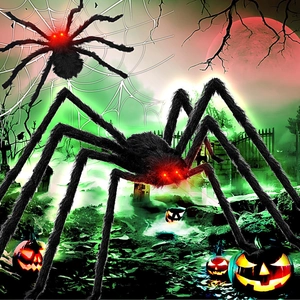 Giant black furry spider with glowing red eyes on web for Halloween yard decoration