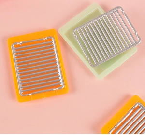 Miniature dollhouse grill pans with orange and green trays for DIY kitchen decor