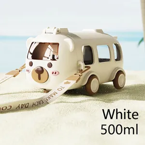 Outdoor detail of 500ml bus-shaped kids water bottle with bear lid and wide nylon strap