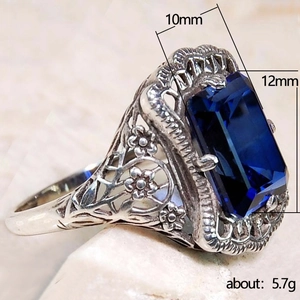 Bague vintage argentée avec zircon bleu royal 10x12mm et motifs ajourés