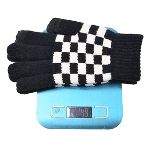 Checkerboard patterned touchscreen knitted gloves shown on a scale weighing 48 grams