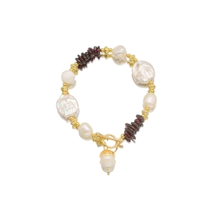 Baroque pearl and red garnet beaded bracelet with gold OT clasp on white background
