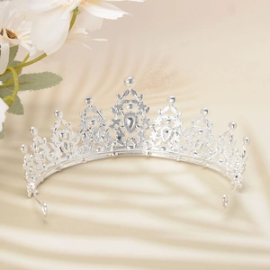 Macro view of silver luxury crystal crown with intricate drop-shaped rhinestones detail