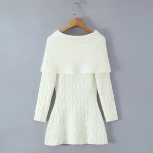 Detail view of the intricate cable knit texture on the white off-shoulder dress