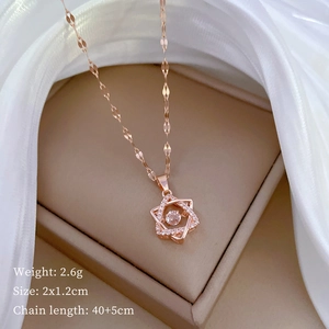 Rose gold hexagram pendant necklace with sparkling gems in a luxury jewelry box