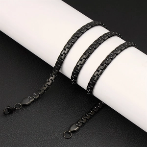 Detail view of black stainless steel flat box chain necklace with secure lobster clasp closure