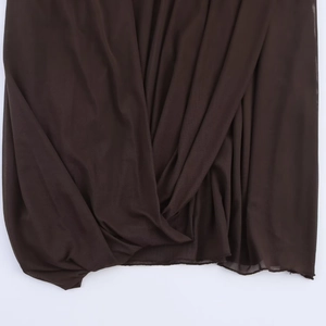 Detailed view of dark brown sheer mesh fabric with pleated texture for slim fit dresses