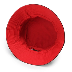 Detail view of double-sided cotton bucket hat with interior cartoon puppy embroidery