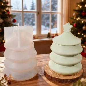 Macro detail of tiered Christmas tree silicone mold with mint green resin storage box