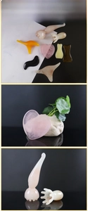 Macro view of various resin gua sha tools and facial massage combs in multiple colors