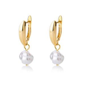 Macro shot of gold-plated hoop earrings featuring baroque freshwater pearl drops